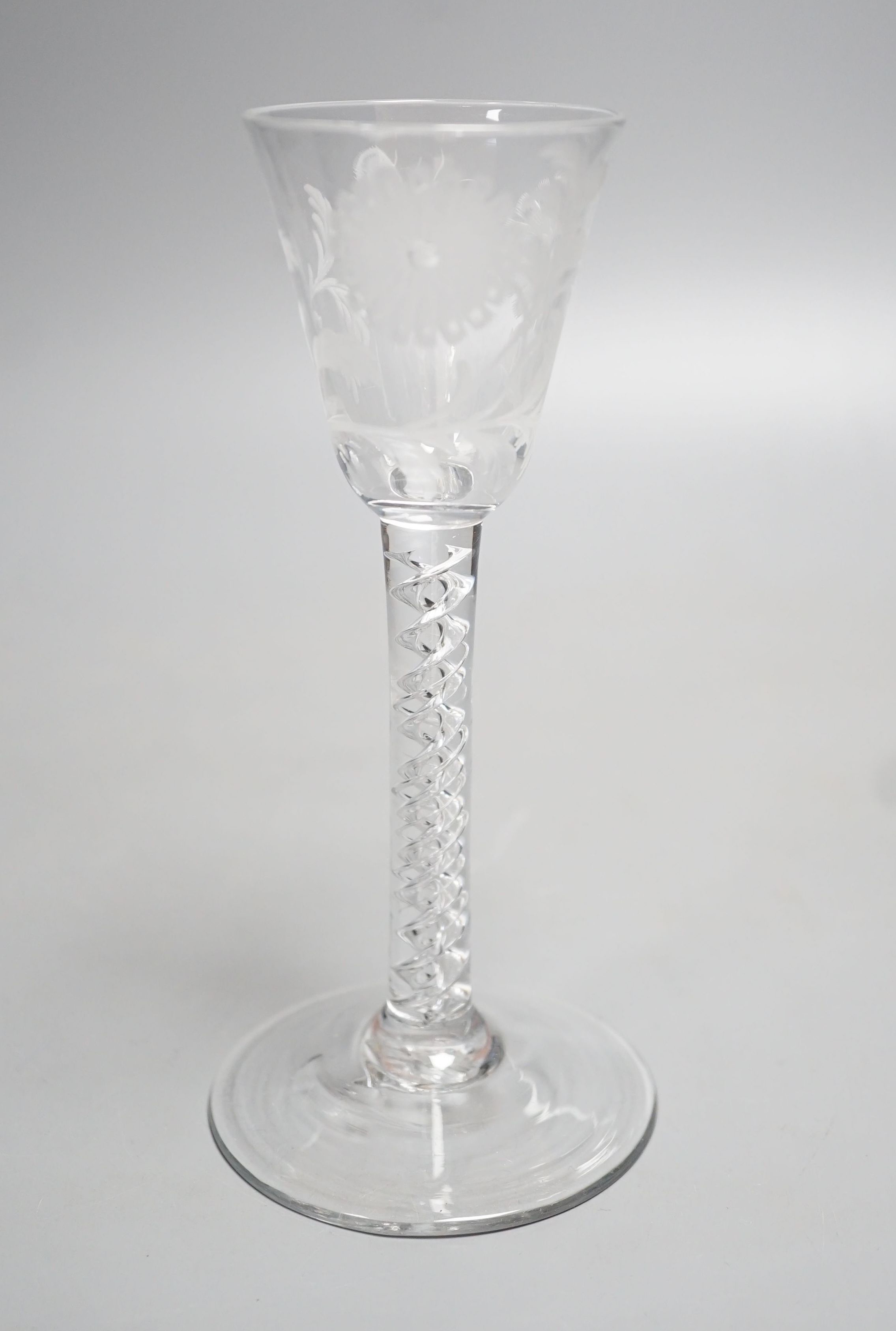 A Georgian air twist stem cordial glass, possibly later engraved with flowers and a butterfly, possibly of Jacobite significance. 16cm